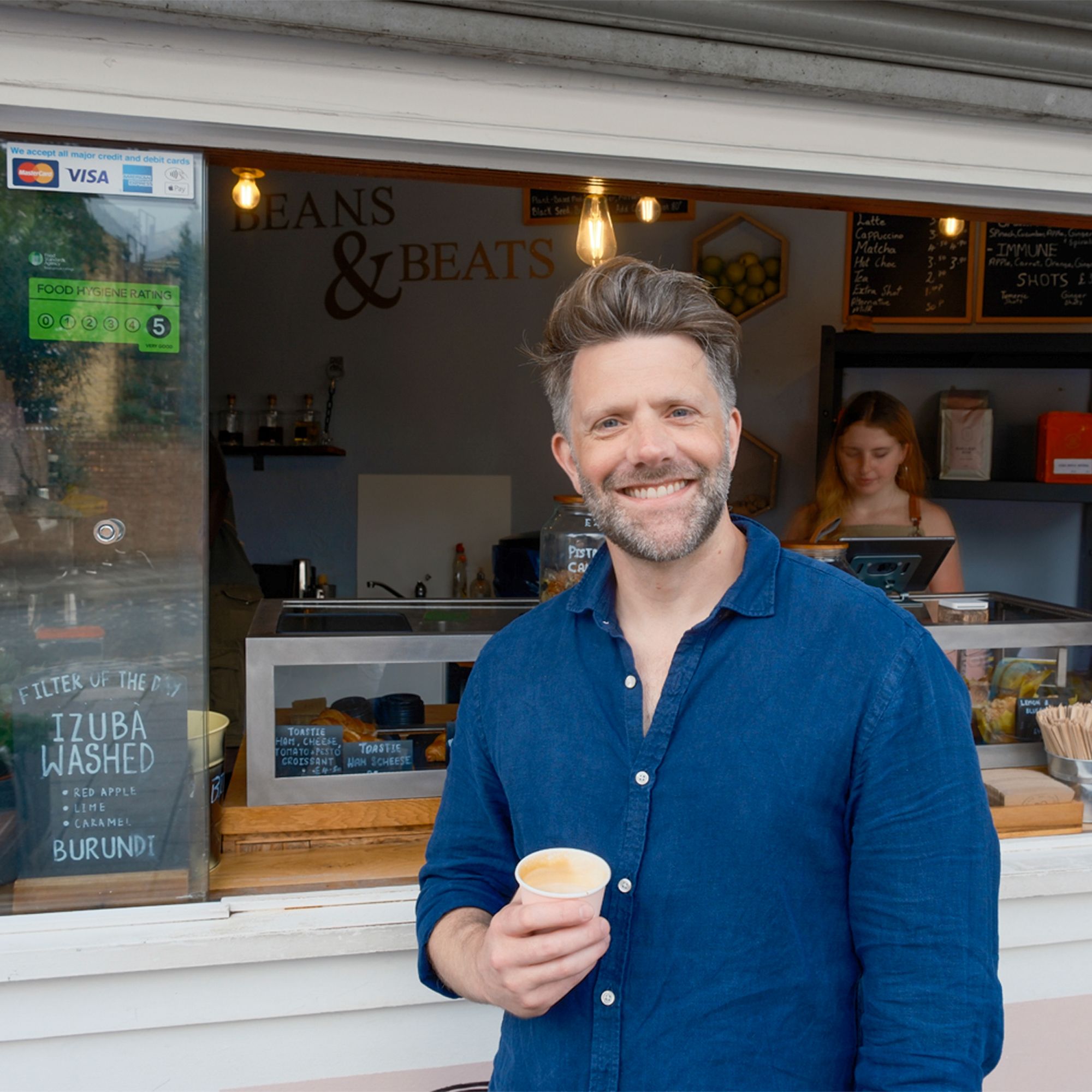 Anthony (Founder of The Fifth) with a flat white at Beans & Beats cafe in Brixton, London